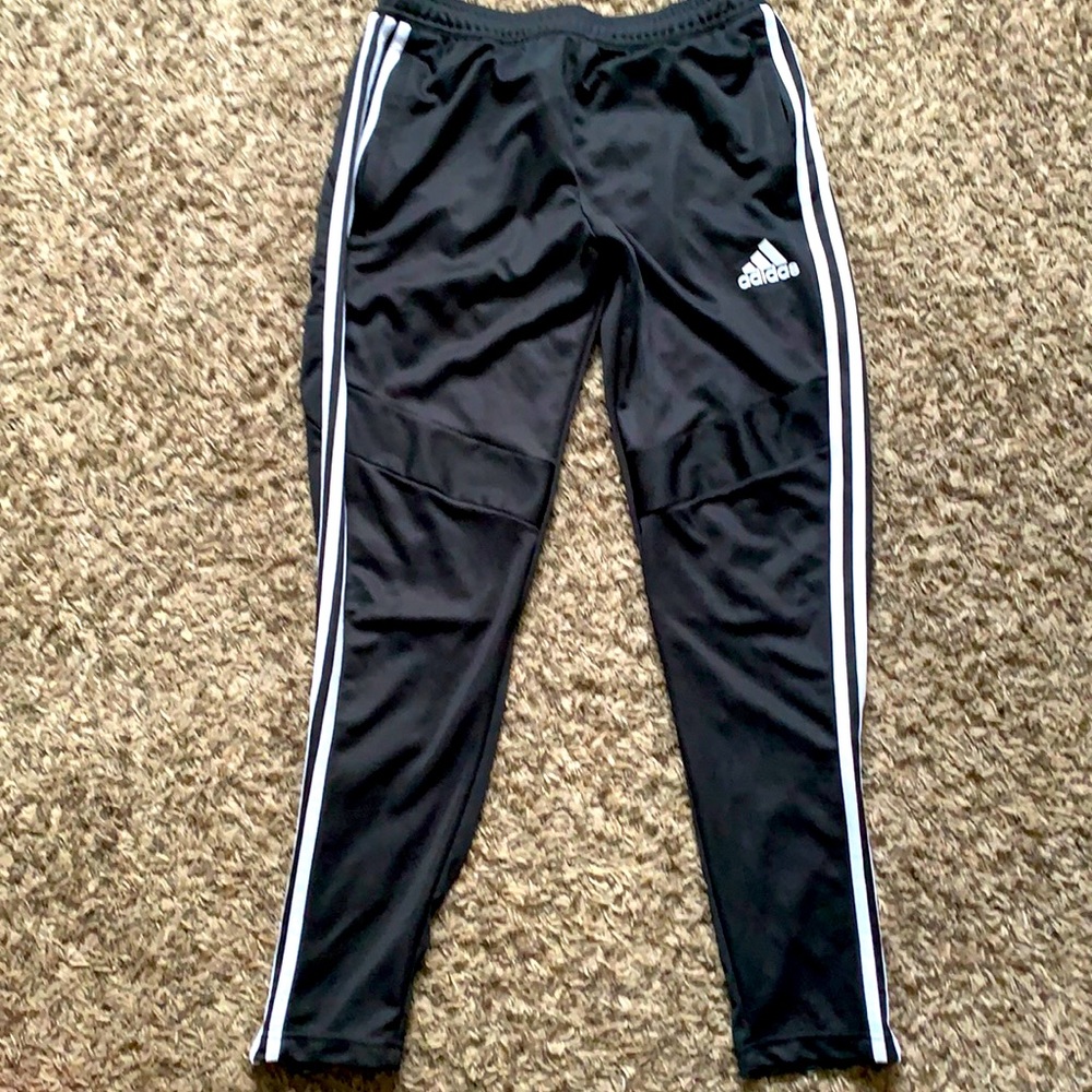Black Adidas pants with white stripes